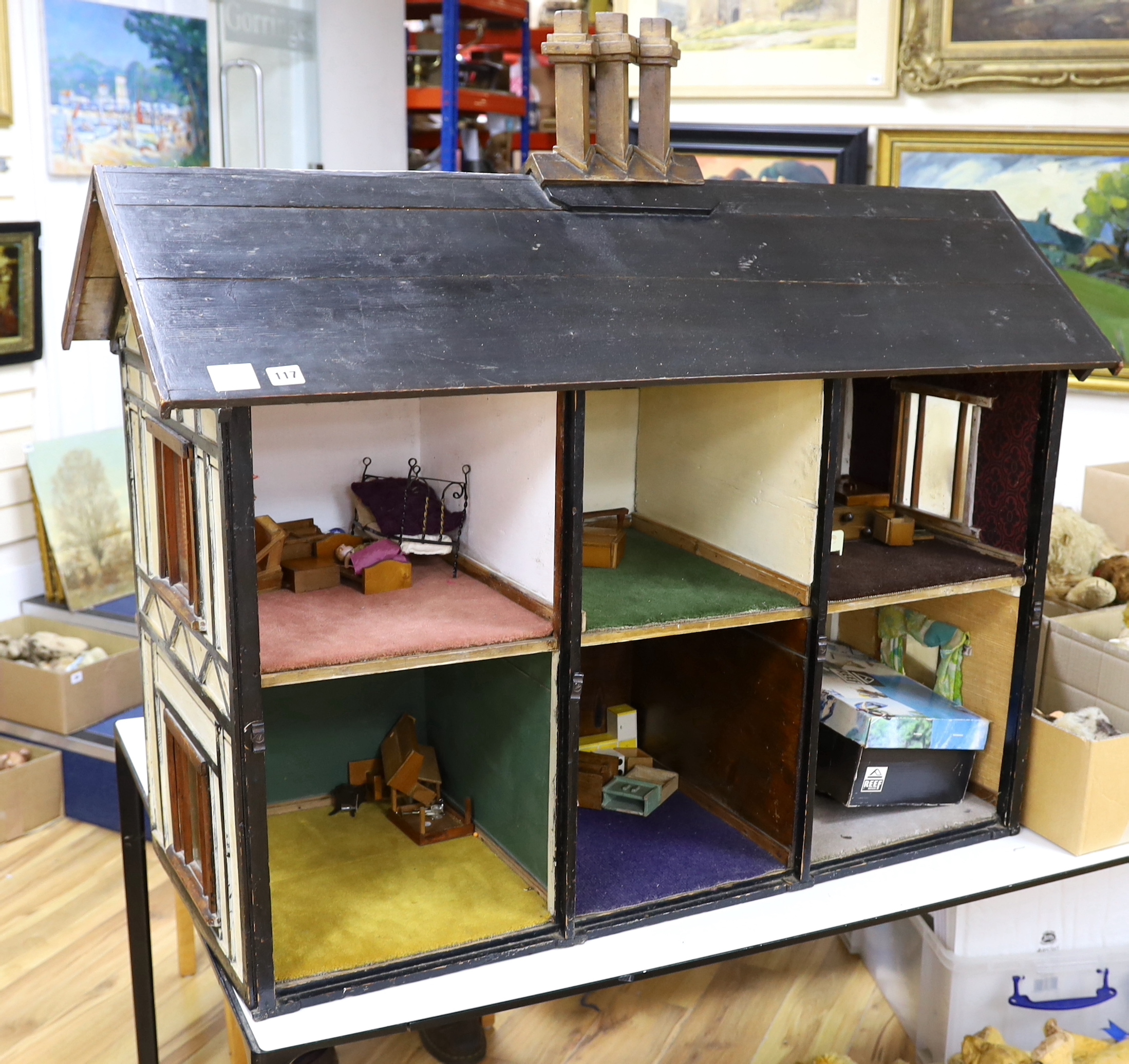 A large furnished English doll's house, circa 1900, presented as William Wordsworth's two floor Tudor-beamed cottage, 119cm x 103cm x 53cm